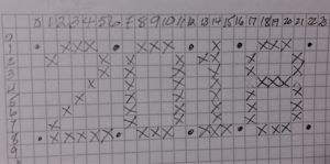 Lettering Chart on graph paper with numbers 2-0-1-8 planned on paper