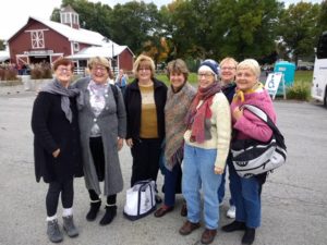 Brookside members pose and their friends pose for a picture after getting off the bus: Eileen, Theresa, Janet, Eileen, Joy, Kathy, Vicki after deboarding.